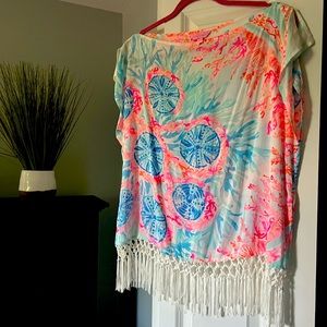 One shoulder or two Lilly top with fringe at bottom.